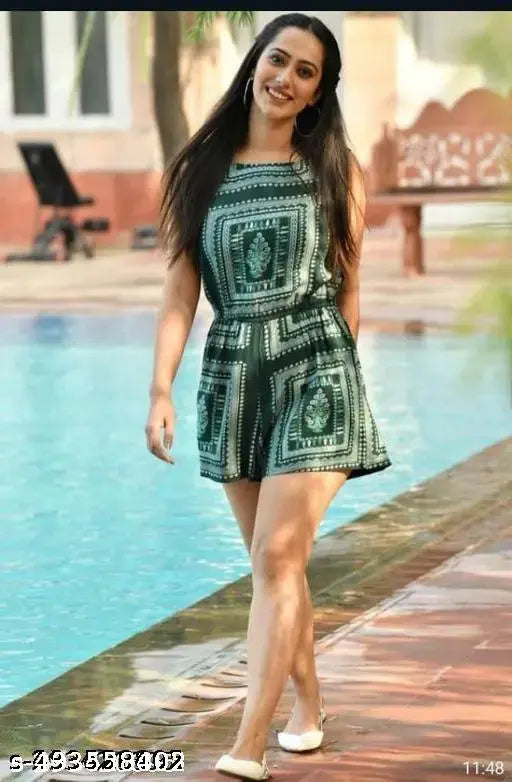 Green rayon jumpsuit with long sleeves, solid pattern on model