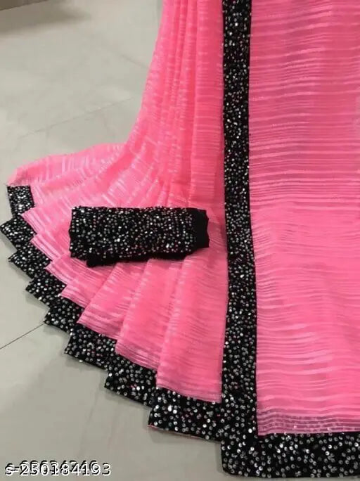 Pink ruffled blouse with black lace trim