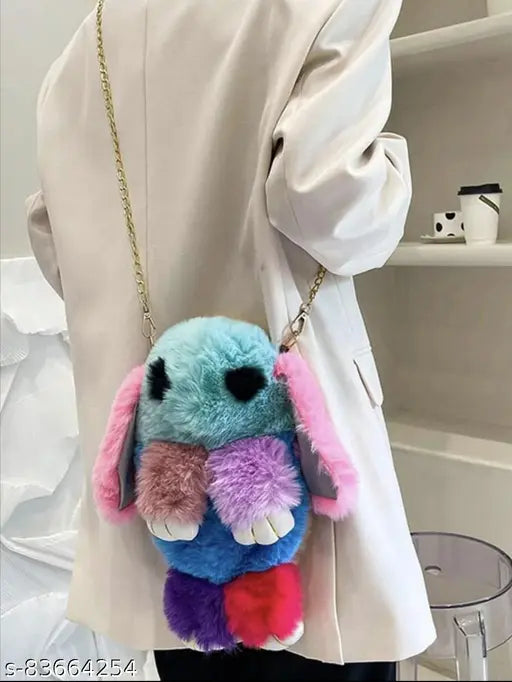 Trendy fuzzy blue, pink, and purple sling bag with a small rabbit on it
