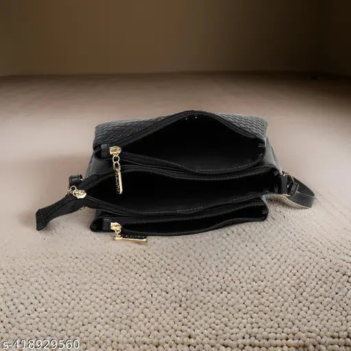 Black leather sling bag with adjustable strap, large front zip pocket, and small side pockets