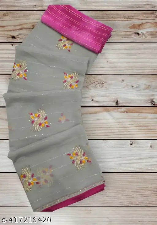 Pink and grey patterned saree with pink pallu and border