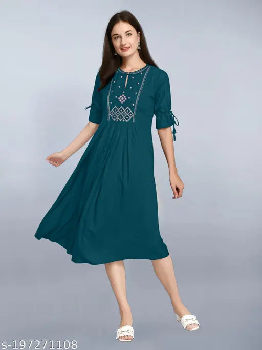 Green long-sleeved kameez with blue embroidery on waist