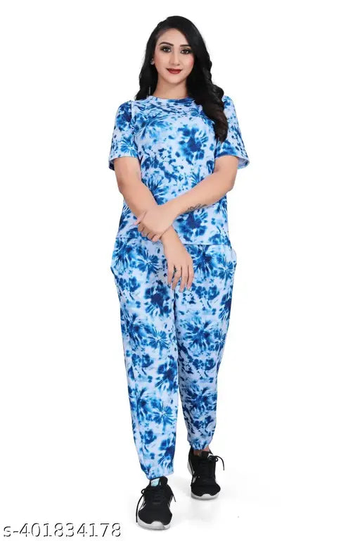 Blue crepe co-ord set for women, featuring printed multicolor design with straight fit top and relaxed-fit trousers. Made of a blend of cotton and lycra for comfort and style. Perfect for traditional or summer outfits. Indian origin