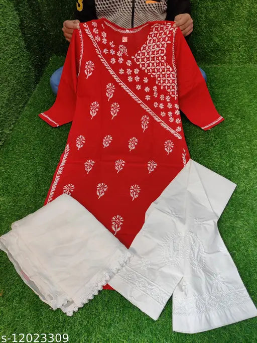 White cotton kurta set with embroidered pants, three-quarter sleeves on a model