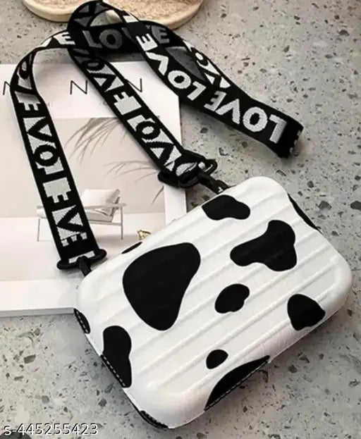 Black and white sling bag with detachable shoulder strap, convertible cosmetic box bag