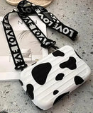 Black and white sling bag with detachable shoulder strap, convertible cosmetic box bag