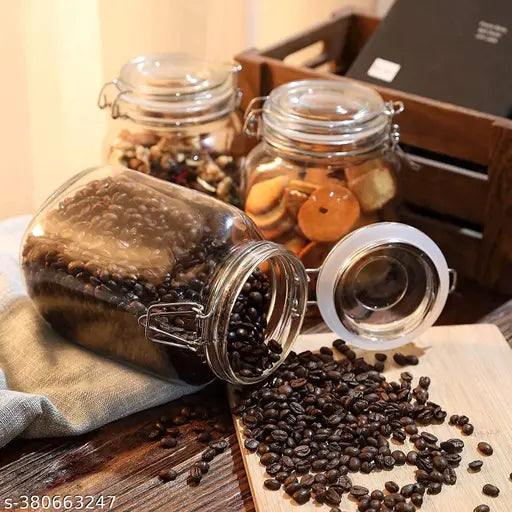 Transparent glass jar with lid, used as kitchen storage, square shape