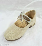 Gold mojari juttis with embellishments, possibly crystal accents
