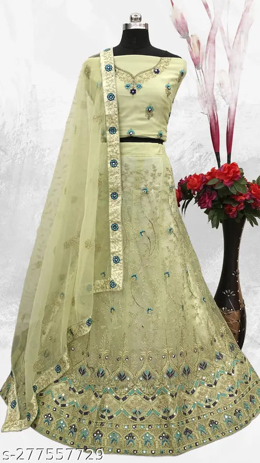 Green net embroidered Lehenga Choli Set with dupatta, featuring eye-catching embellishments. Handcrafted Indian bridal wear for women