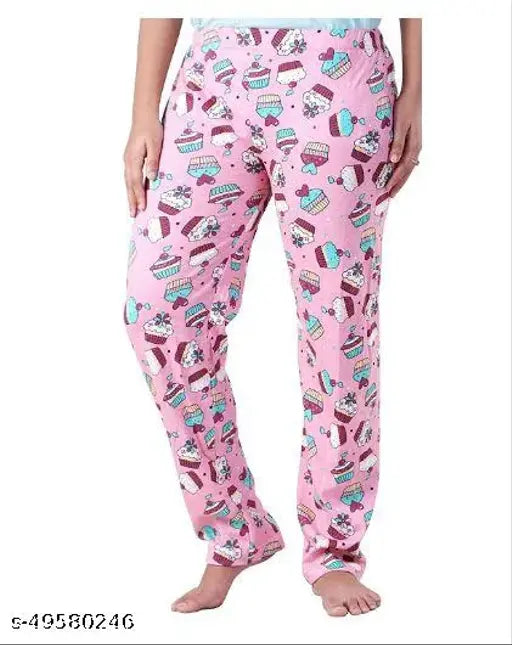 Pink cotton pyjamas with lower cut, featuring a playful candy shop print design