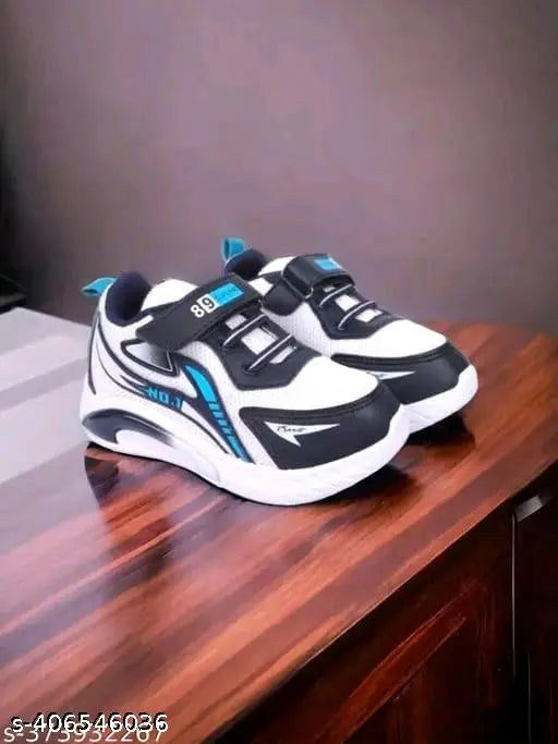 Pair of blue and white PVC casual shoes with a clear crystal center