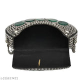 Silver metal clutch, green gemstone accent, black interior lining