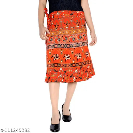 The image features a woman wearing a vibrant, patterned red cotton wraparound skirt