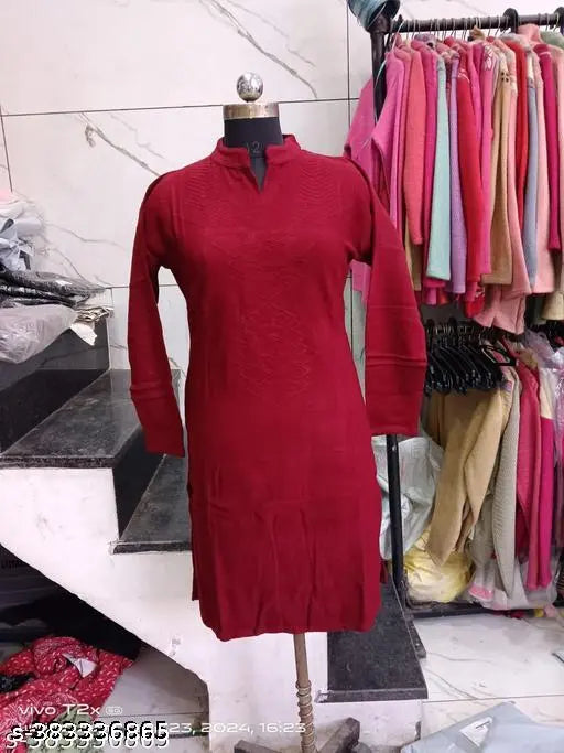 Red long-sleeved kameez dress with button front, displayed on mannequin