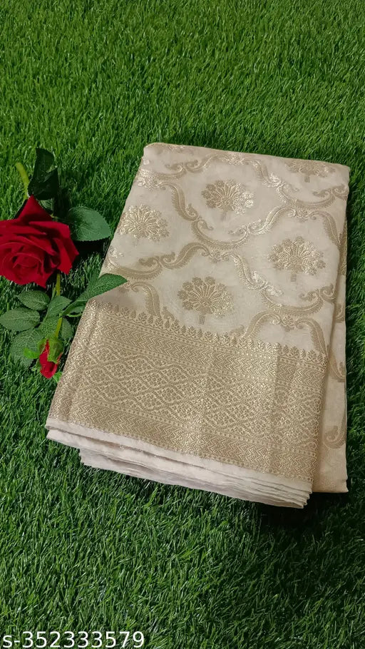 Golden Georgetta patterned silk sari, elegantly draped