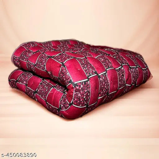 Red patterned blanket with a zigzag stitch design