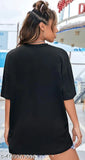 A large beige women's casual t-shirt with a black graphic on the front, available in multiple colors for sizes small through XXL