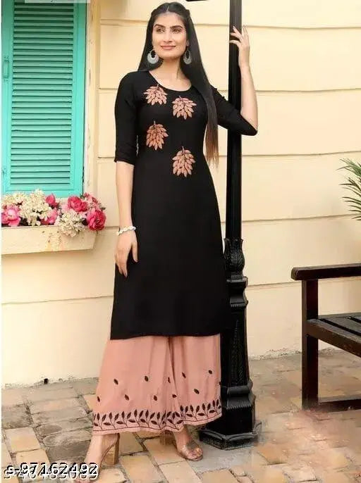 Black rayon kurta with embroidered peach plazzo, three-quarter sleeves set on mannequin