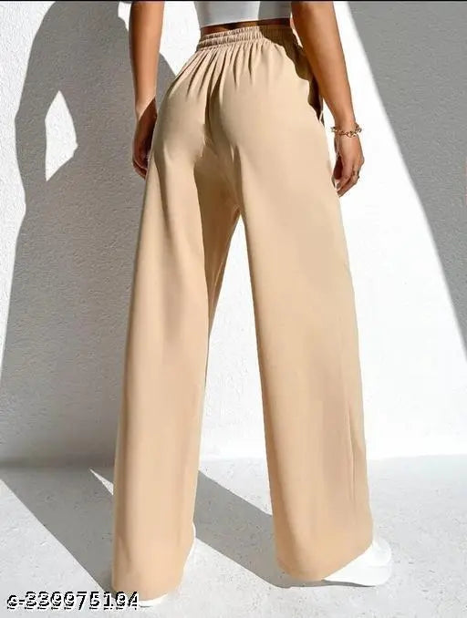 Tan high-waisted trousers with a wide cuff
