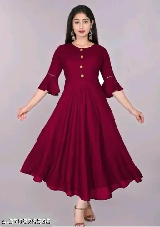 Maroon kameez with ruffled sleeves, embroidered details and long hemline