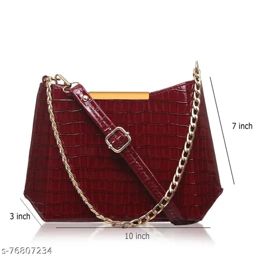 Red synthetic leather shoulder sling bag with a chain