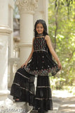 Black embroidered Georgette sharara set with matching dupatta, suitable for special occasions. 3-4 years: top length 20 inches; 4-5 years: top length 20 inches; 5-6 years: top length 22 inches; and so on up to 14-15 years. Handcrafted in India