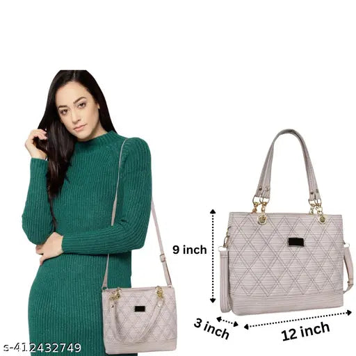 A slender, light pink handbag with a quilted pattern and two handles