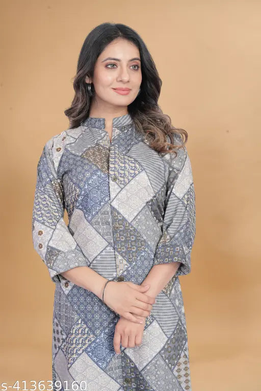 Printed cotton and polycotton two-piece loose fit kurta set with palazzo bottoms for women, featuring three-quarter sleeves. Size options available from S to XXXL. Indian handloom fashion