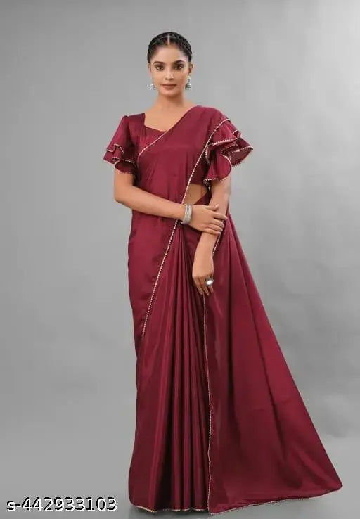 Royal maroon lace saree with a stitched blouse, featuring long sleeves and intricate lace details