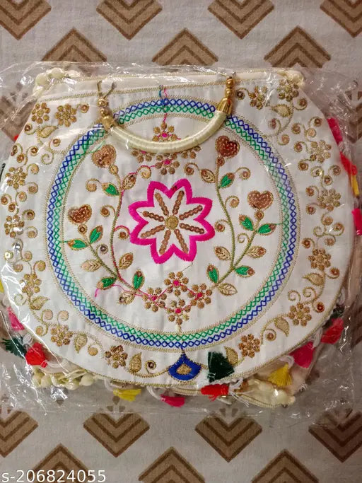 Colorful embroidered handbag with floral design, fabric details