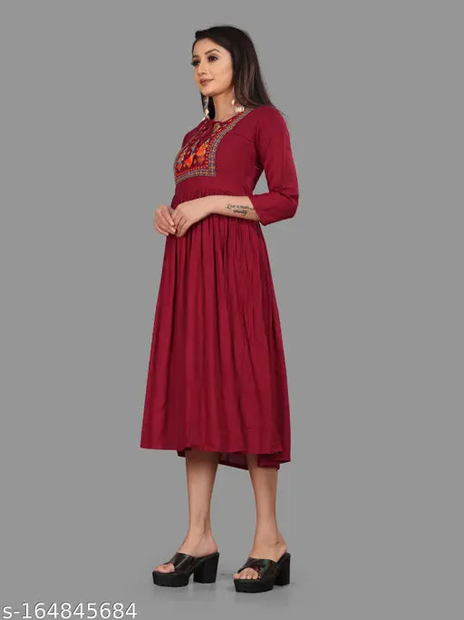 Women's embroidered viscose rayon A-line kurta, solid combo, three-quarter sleeves. Stylish, soft, all-season fashion choice from Shree Bright World, India