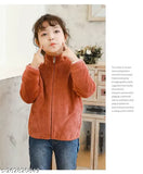 A young girl wearing a red cardigan with a front zipper