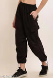 Women's black high waist trousers with drawstring closure, slim fit, relaxed waistband, cuffed legs