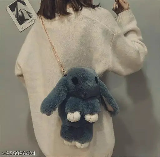 Cute blue slingbag with a stuffed toy, styled after a fur rabbit, perfect accessory for women and children