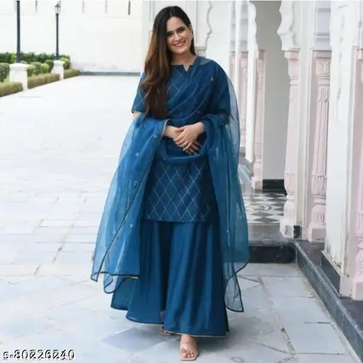 A blue kameez with matching long skirt, traditional attire