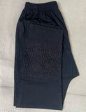 Black Lucknowi Cotton Lycra trouser for women with embroidered net and side pockets. Indian-made chikankari pants on mannequin
