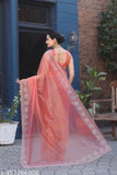 Orange net saree with solid art silk blouse, embroidered pattern on display