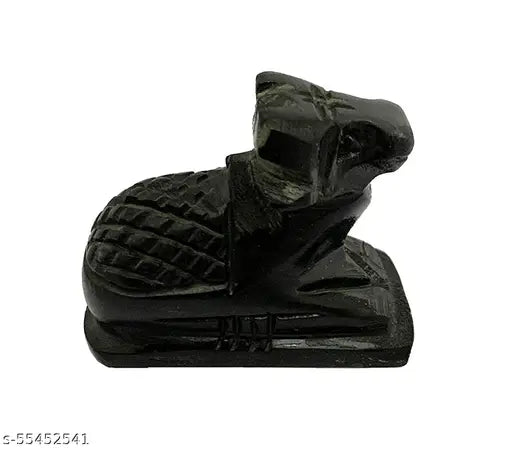 A small black marble sculpture of a cow