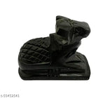A small black marble sculpture of a cow