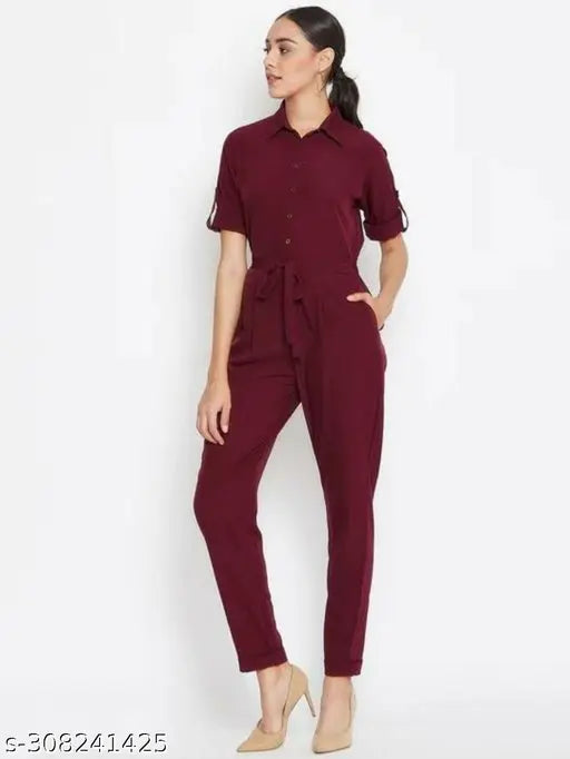 Black crepe button down roll-up jumpsuit with elastic waist, suitable for Indian body type