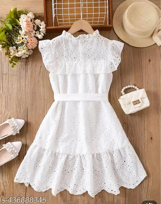 Cute girls cotton dress, self-design net pattern with short sleeves. Kids dress featuring premium quality schiffli work embroidery from India