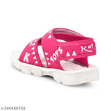 Pink sandals with a playful design, featuring white soles and straps