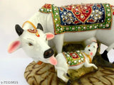 Handcrafted, resin marble dust Kamdhenu cow and calf figurine for spiritual decor. Traditional Indian divine showpiece with stone studs