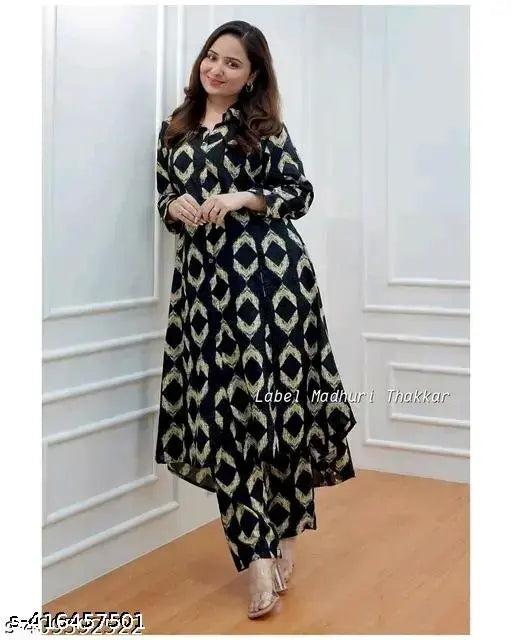 Black rayon kurta set with printed net pattern, three-quarter sleeves, and matching pants for women's fashionable everyday wear