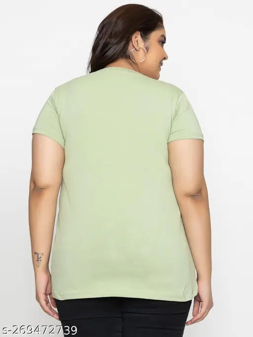 This is an image of a person wearing a light green round neck, half sleeve cotton t-shirt. The t-shirt has short sleeves and appears to be oversized in style