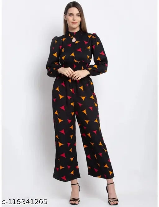 Designer crepe smoking jumpsuit, long sleeves, printed net pattern, keyhole neck & puff sleeves. Indian partywear elegant smoking outfit on mannequin