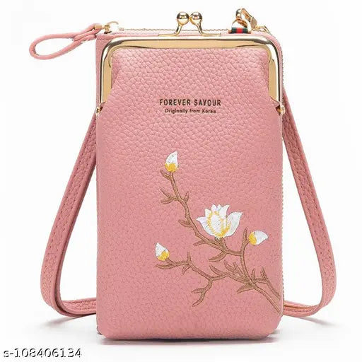 Pink crossbody bag, sling style, for women. Flap closure with gold zipper pulls. Phone and wallet pockets