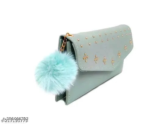 Teal clutch with fuzzy tassel and gold hardware