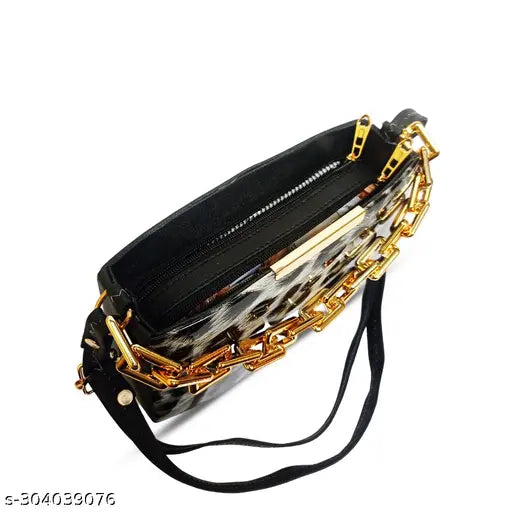Trendy metallic gold chain bag with a black strap