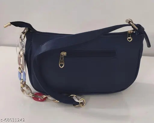 Lightweight vogue-style blue sling bag with adjustable belt, featuring a zip closure and multiple card slots